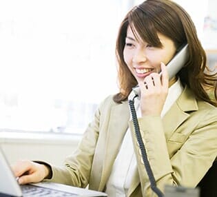 Woman Talking on Telephone — Telecommunications Services in Johnston, IA